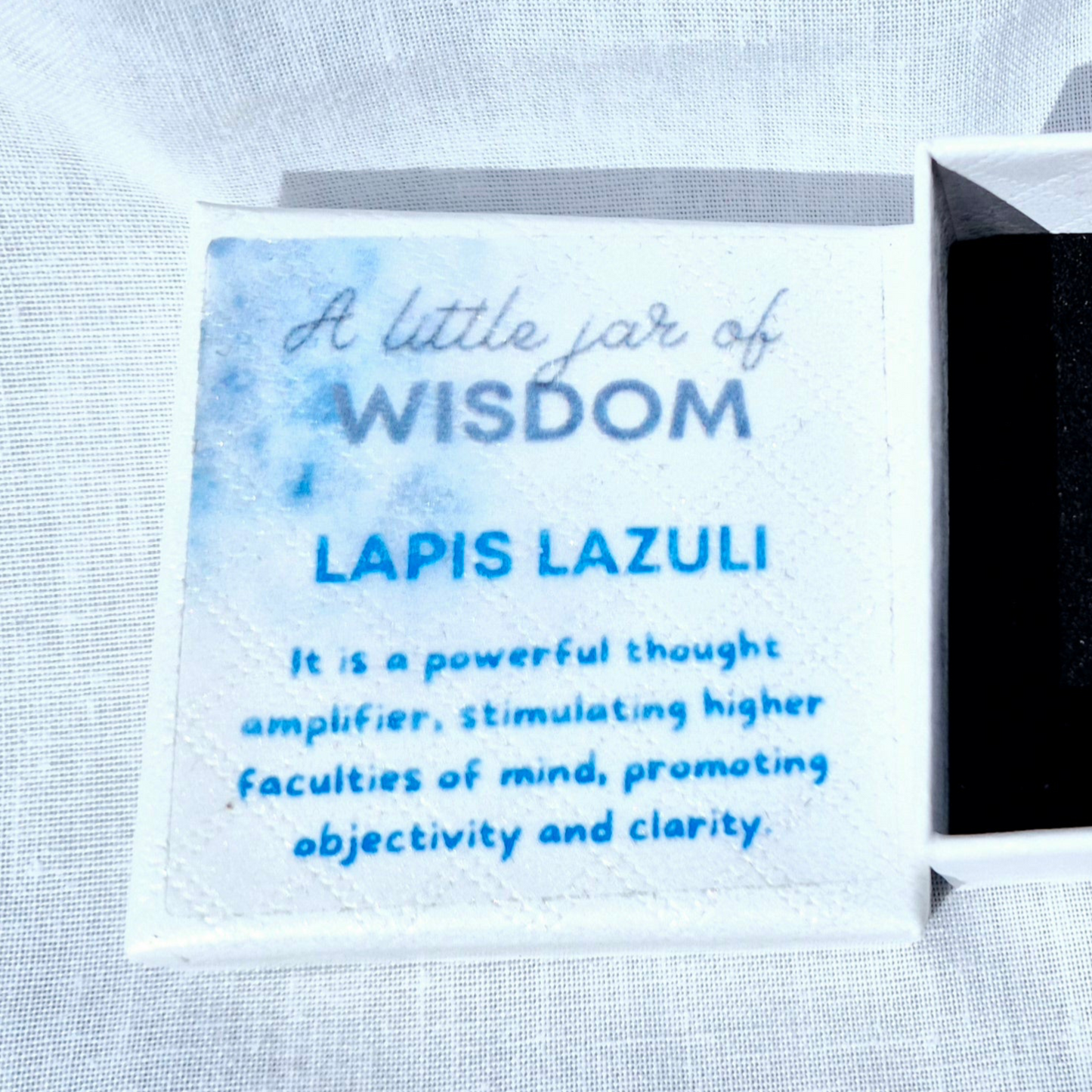Glass jar filled with vibrant Lapis Lazuli chips