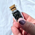 Glass jar filled with black tourmaline chips