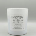 White candle with 'Capricorn' label on a gray background