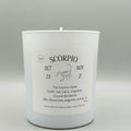 White candle with Scorpio zodiac label on a gray background