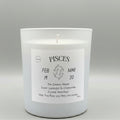 White candle with a label indicating 'Pisces' on a gray background