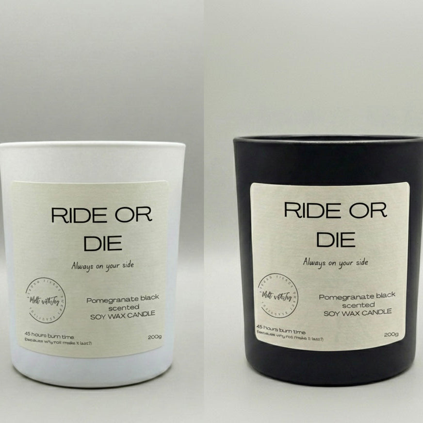 Two candles labeled 'Ride or Die' on a gray background