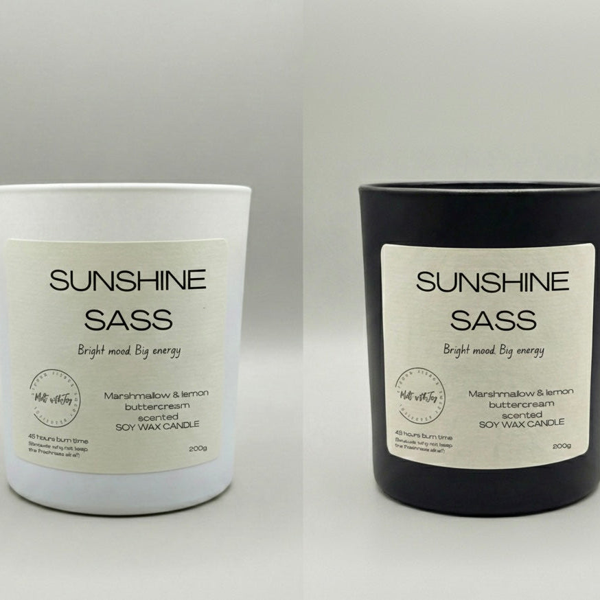Two candles labeled 'Sunshine Sass' on a light gray background