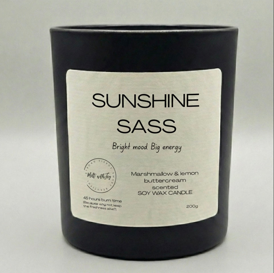 Black candle with a label on a light gray background