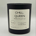 Black candle with a 'Chill, Queen' label on a light gray background