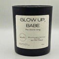 Black candle with a label on a light gray background