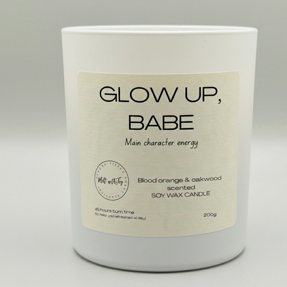 White candle with a beige label on a gray background