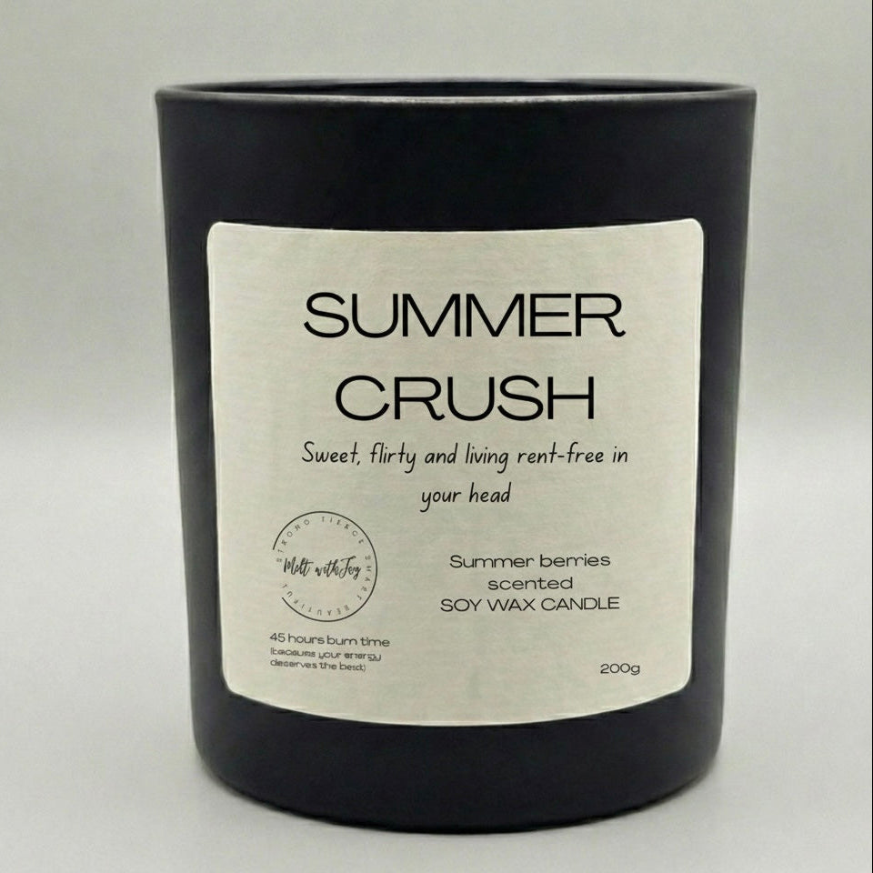 Black candle with a label titled 'Mama Bear Mode' on a light gray background