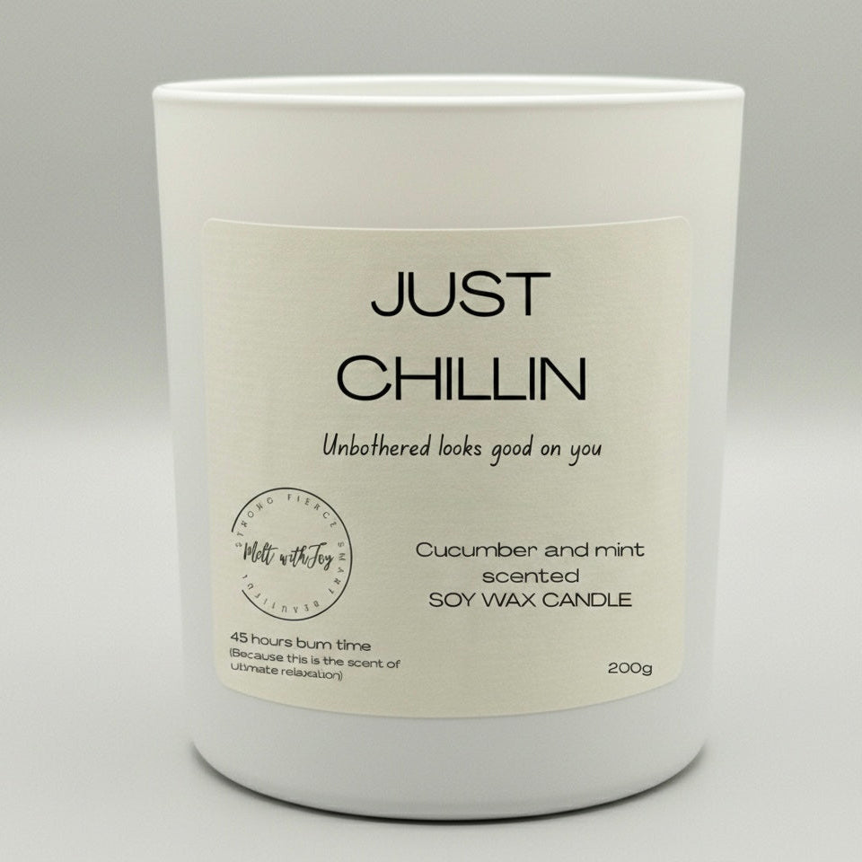 Candle with 'Just Chillin' label on a gray background