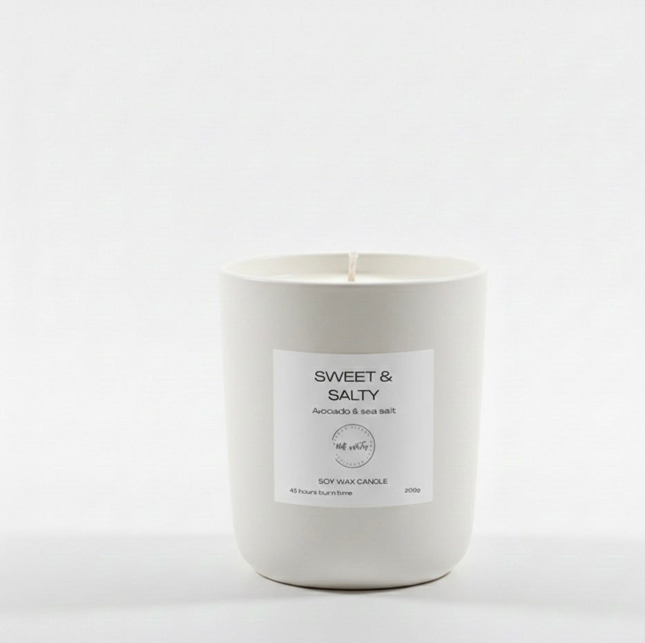 White candle with a label on a white background