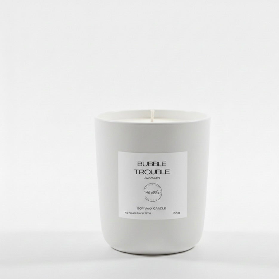 White candle with a label on a white background