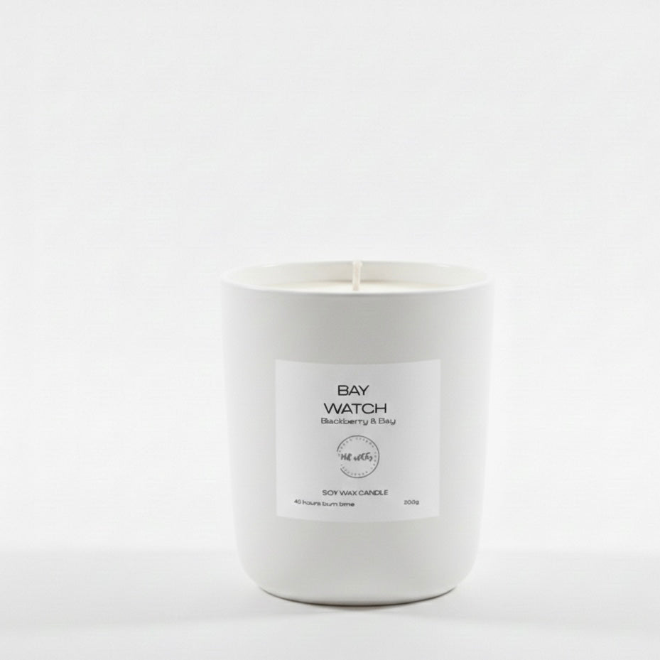 White candle with a label on a white background