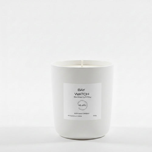 White candle with a label on a white background