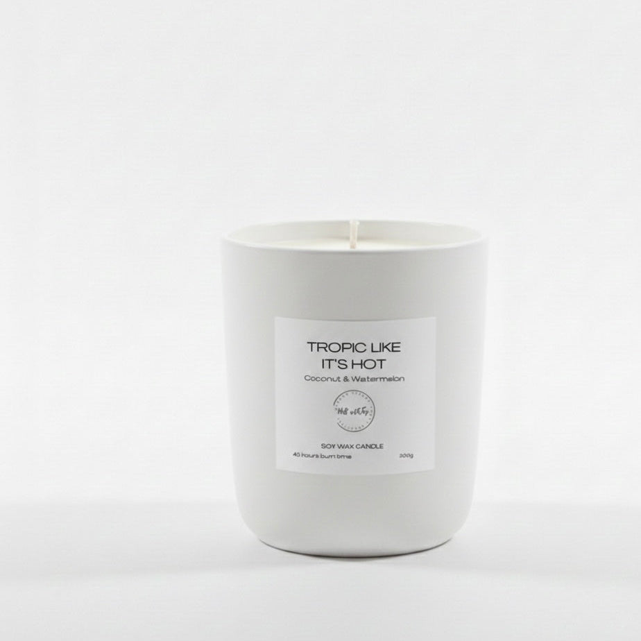 White candle with a label on a white background