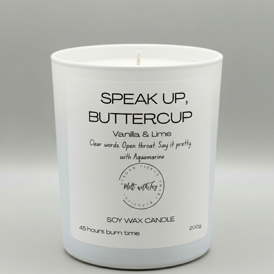 White candle with a label on a gray background