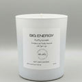 White candle with a label on a gray background